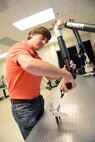 Tracy Rycroft, 573rd Commodities Maintenance Group computer numerical control programmer, digitally scans a recently manufactured part in order to compare it against drawing specifications. Officials from the Navy and NORDAM, a global aerospace manufacturing and repair company, visited the 402nd CMXG, April 26, 2016, to celebrate a partnership that was formed in 2014 to manufacture F/A-18 outer wing panel spars to support NORDAM’s F/A-18 Legacy Hornet wing repair lines. (U.S. Air Force photo by Tommie Horton)