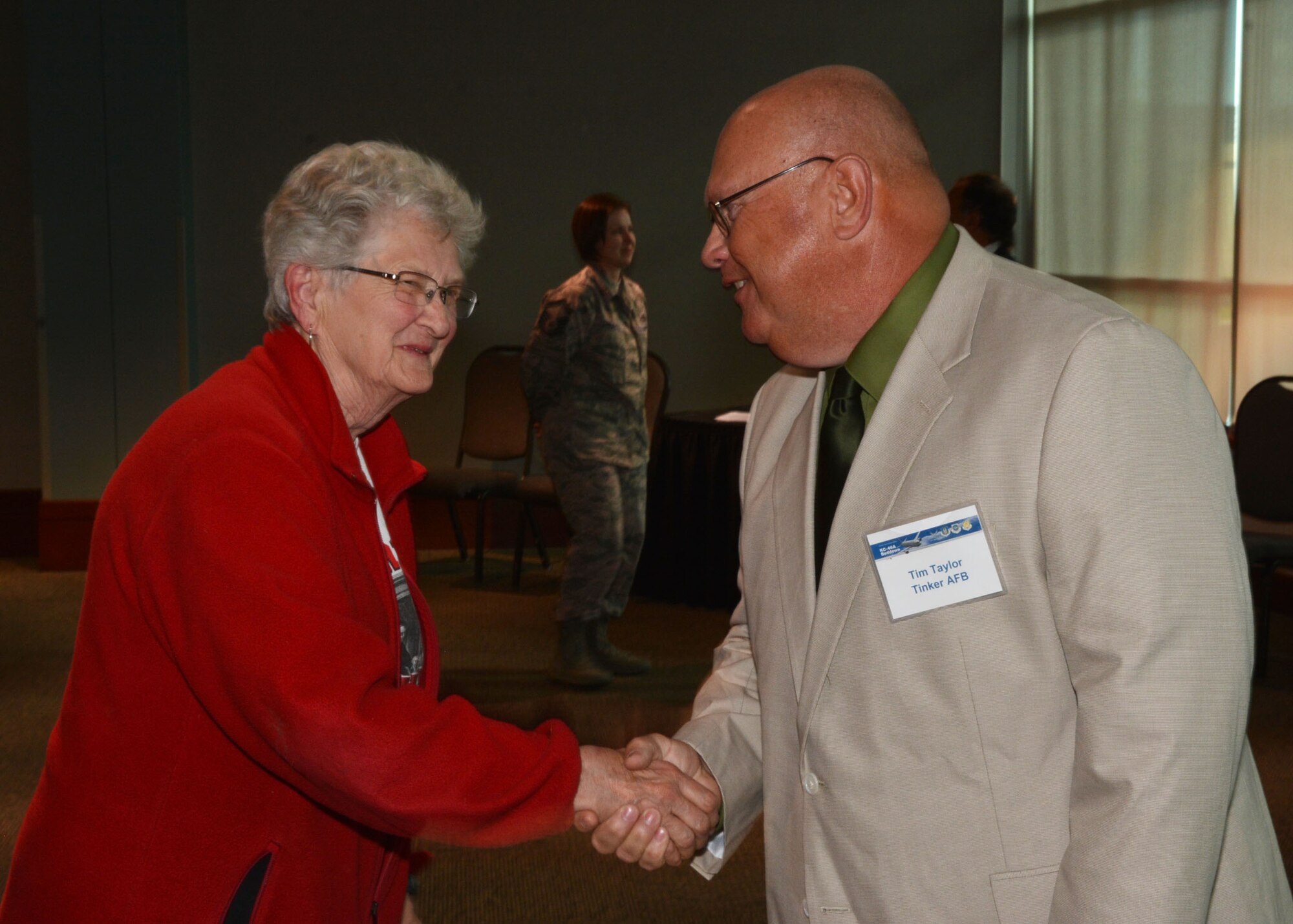 Local resident Phyllis Klein is greeted by Tim Taylor, an environmental health specialist with the 72nd Air Base Wing Civil Engineer Environmental Compliance Office, at the KC-46A public scoping meeting April 21 at the Sheraton Reed Conference Center in Midwest City.  (Air Force photo by Tech. Sgt. Lauren Gleason/Released)
