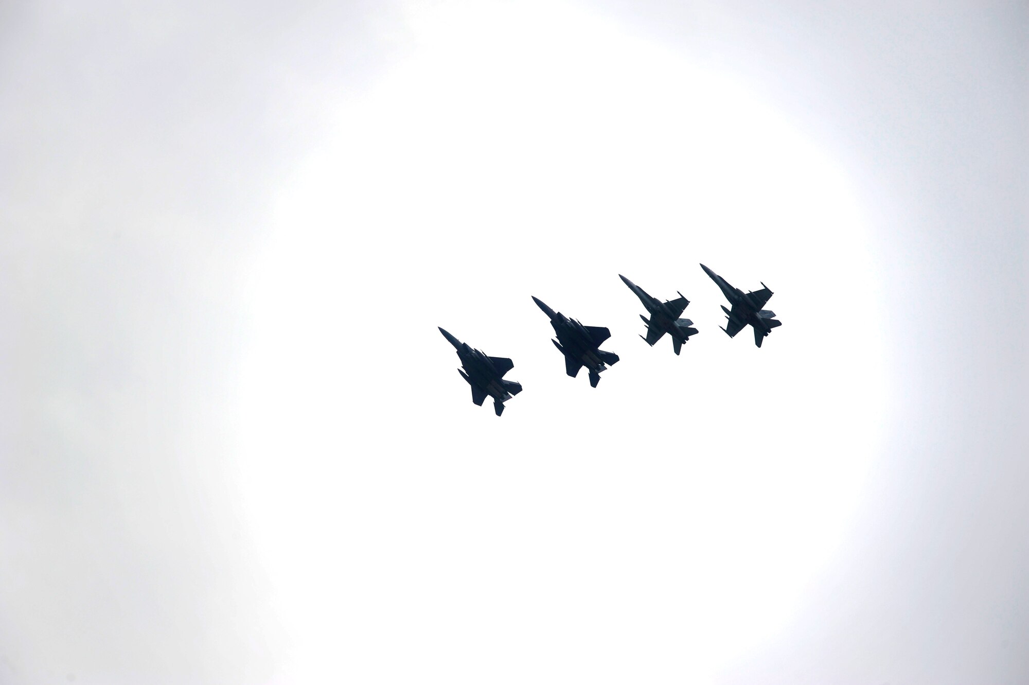 F-15K Slam Eagles from the 11th Fighter Wing, Daegu Air Base, Republic of Korea, fly in a four-ship formation alongside F-18s from Marine Air Group 12, Marine Corps Air Station Iwakuni, Japan, during Max Thunder 16 at Kunsan Air Base, Republic of Korea, April, 20, 2016. This exercise is held annually to integrate U.S. and ROK forces to train for air-to-air and air-to-ground missions to continuously sharpen mutual understanding and cooperation between the two nations. (U.S. Air Force photo by Staff Sgt. Nick Wilson/Released)