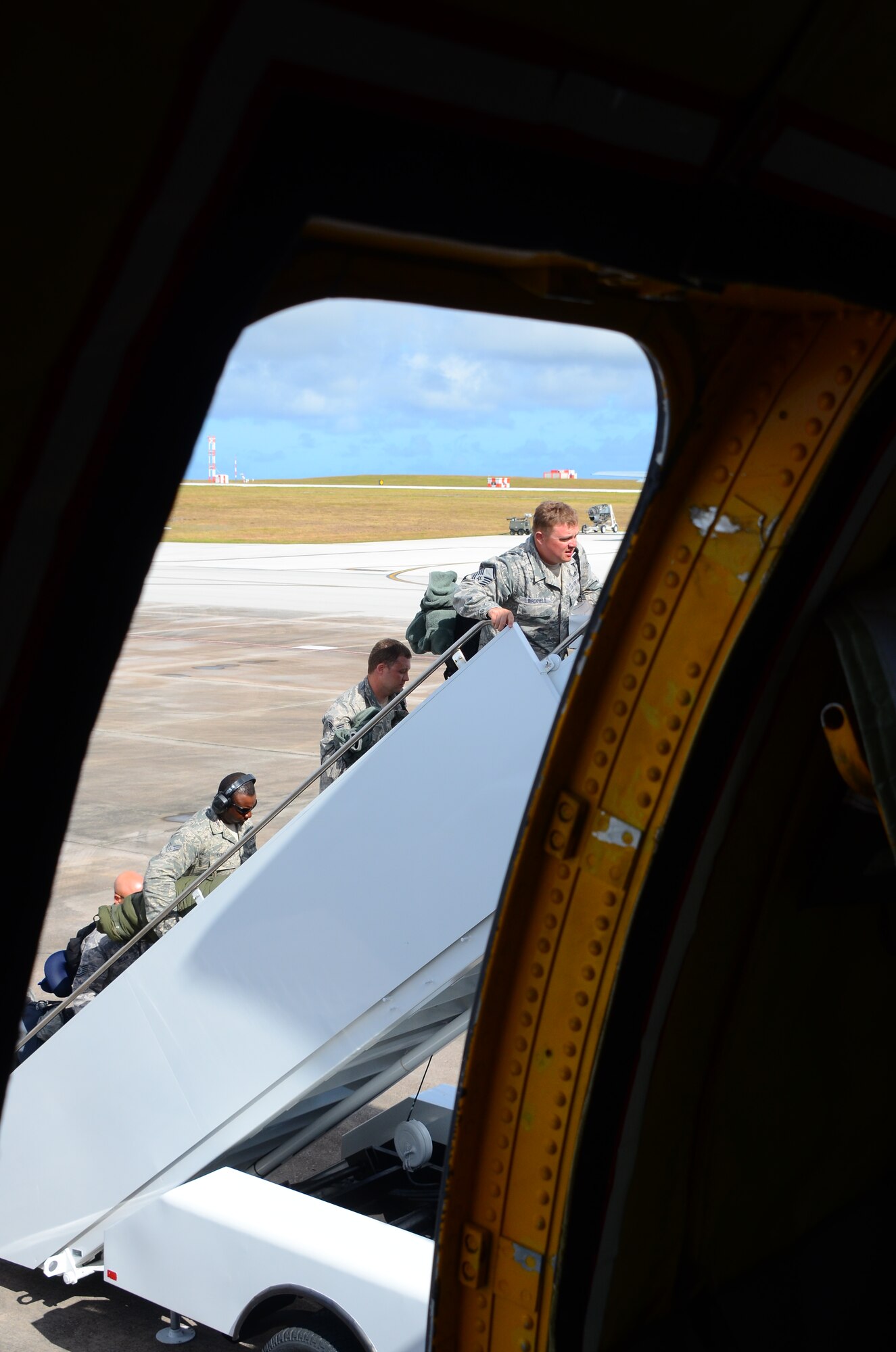 Airmen with the 175th Engineer Squadron, Maryland Air National Guard, board a KC-135R Stratotanker assigned to the 128th Air Refueling Wing, Wisconsin Air National Guard. An aircrew with the 128 ARW flew a 6-day mission ready airlift to transport the Maryland ANG members from their training in Guam to their home base near Baltimore April 20-25, 2016. (U.S. Air National Guard photo by Tech. Sgt. Meghan Skrepenski/Released)