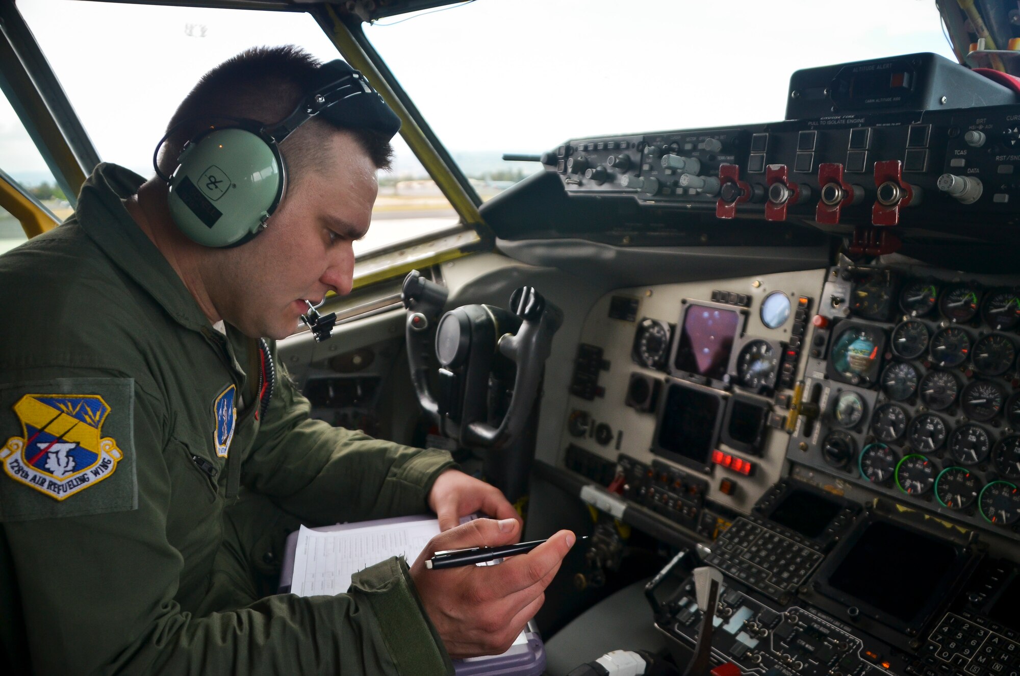 Staff Sgt. Tim Schell, a crew chief with the 128th Air Refueling Wing, Wisconsin Air National Guard, monitors the even distribution of fuel on a KC-135R Stratotanker during fueling operations at Joint Base Pearl Harbor Hickam, Hawaii.  This was one of the five stops that the 128 ARW aircrew flew to during a 6-day mission ready airlift to transport Maryland Air National Guard members from their training in Guam to their home base near Baltimore April 20-25, 2016.   (U.S. Air National Guard photo by Tech. Sgt. Jenna V. Lenski/Released)
