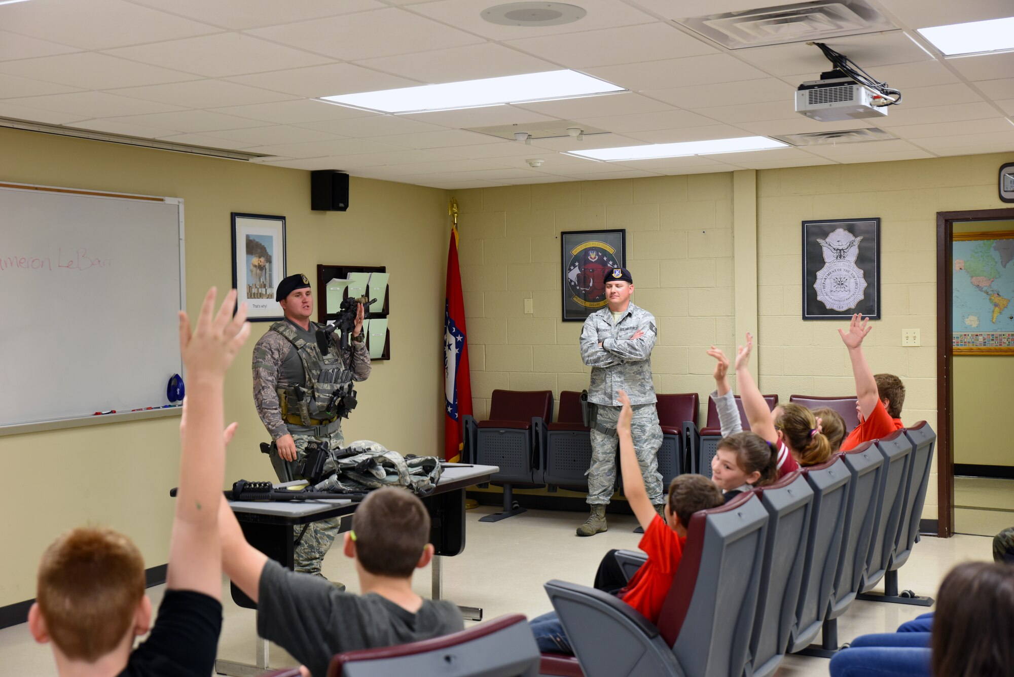 Staff Sgt. Cameron Lebarr, 188th Security Forces Squadron member, shows students from Mansfield Elementary School tools and weapons that the 188th SFS uses April 20, 2016, during their tour at Ebbing Air National Guard Base, Fort Smith, Ark. The students were shown careers in civil engineering, remotely piloted aircraft and security forces. (U.S. Air National Guard photo by Senior Airman Cody Martin/Released)