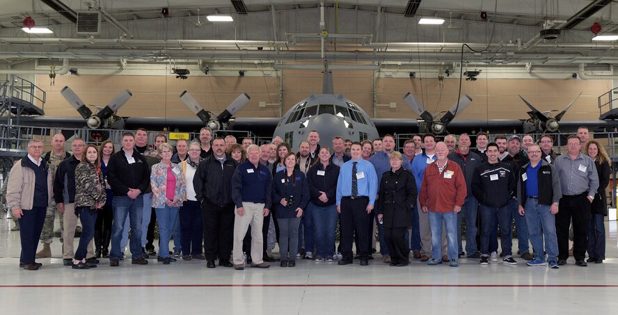 Civilian employers pose with a C-130 Hercules aircraft during an Employer Support of the Guard and Reserve “Breakfast with the Boss” event at the 182nd Airlift Wing, Illinois Air National Guard, in Peoria, Ill., April 27, 2016. The attendees toured the base to see firsthand how their employees serve the Illinois National Guard. (U.S. Air National Guard photo by Staff Sgt. Lealan Buehrer)