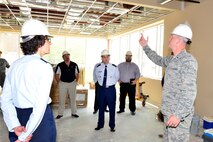 MCGHEE TYSON AIR NATIONAL GUARD BASE, Tenn. - 1st. Lt. Travis Vaughn, 134th Civil Engineering Squadron, explains a room divider system to Col. Jessica Meyeraan and Col. Kevin Donovan, among others, during a tour of the I.G. Brown Training and Education Center's construction here, April 28, 2016, at McGhee Tyson Air National Guard Base. The group toured the site to familiarize Donovan with the project for a new facility, prior to a change of command. (U.S. Air National Guard photo by Master Sgt. Jerry Harlan/Released)