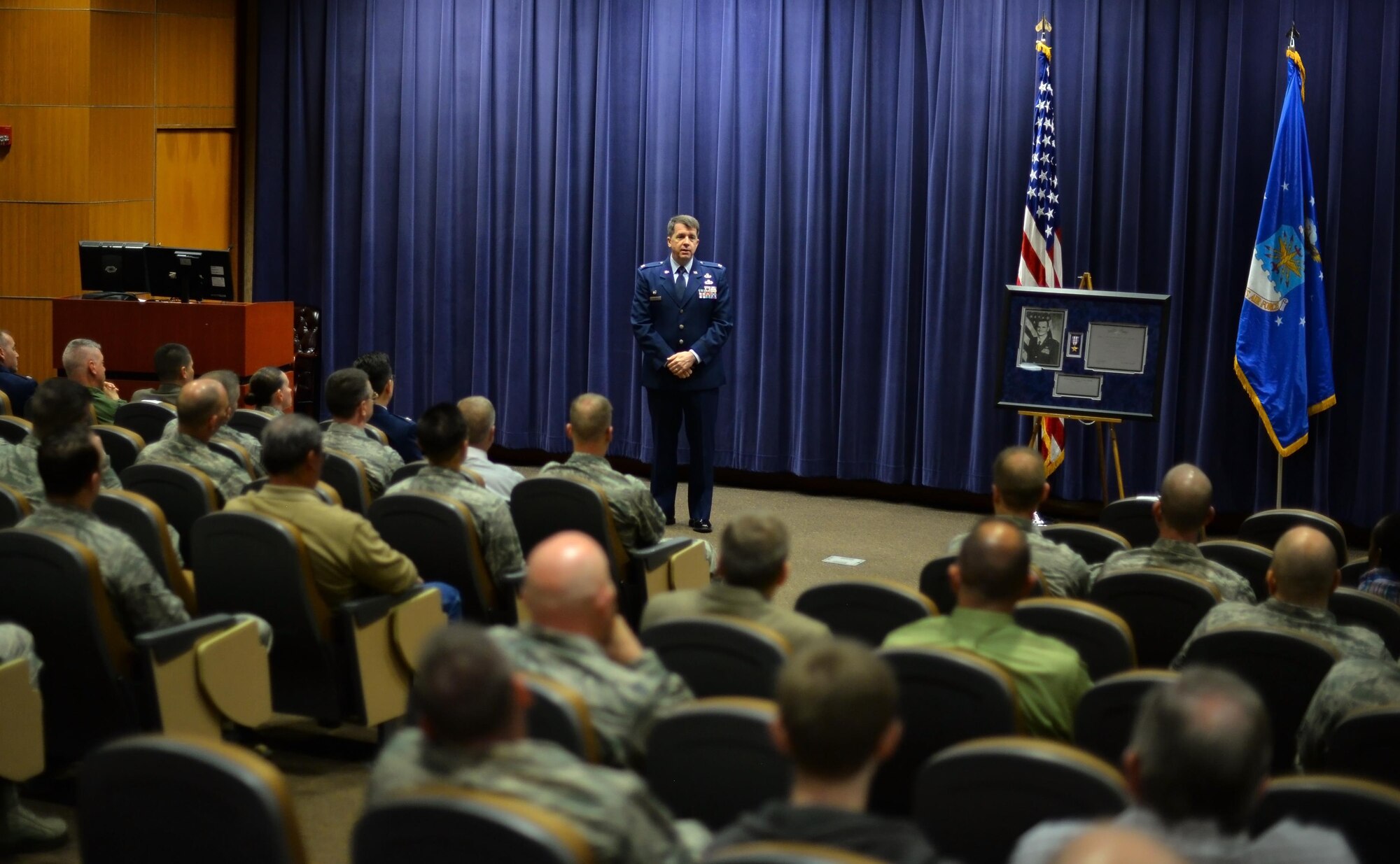 U.S. Air Force Col. Donald Shannon, 2nd Weather Group commander, speaks to weather professionals during a memorial ceremony in honor of U.S. Air Force Capt. Nathan Nylander at the 557th Weather Wing auditorium, Offutt Air Force Base, Neb., April 27, 2016.  Nyalnder was killed at Kabul International Airport on April 27, 2011. (U.S. Air Force photo by Josh Plueger)