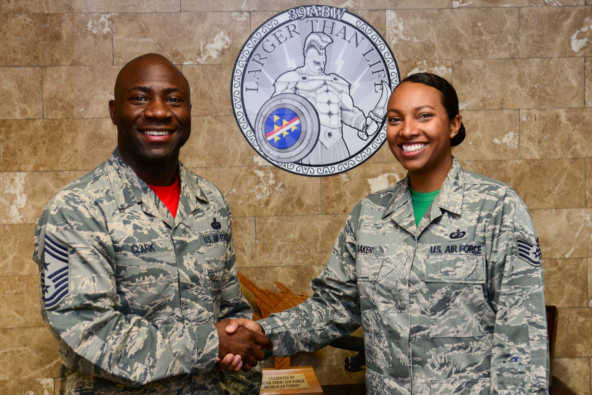 Chief Master Sgt. Vegas Clark, 39th Air Base Wing command chief, stands with Staff Sgt. Chelsea Baker, 39th Contracting Squadron contract administrator, in the 39th ABW front office before beginning Baker’s chief shadow day April 29, 2016. Airmen are chosen for the command chief’s shadow program based on their commander’s recommendation about their dedication to the mission. (U.S. Air Force photo by Staff Sgt. Caleb Pierce/Released)