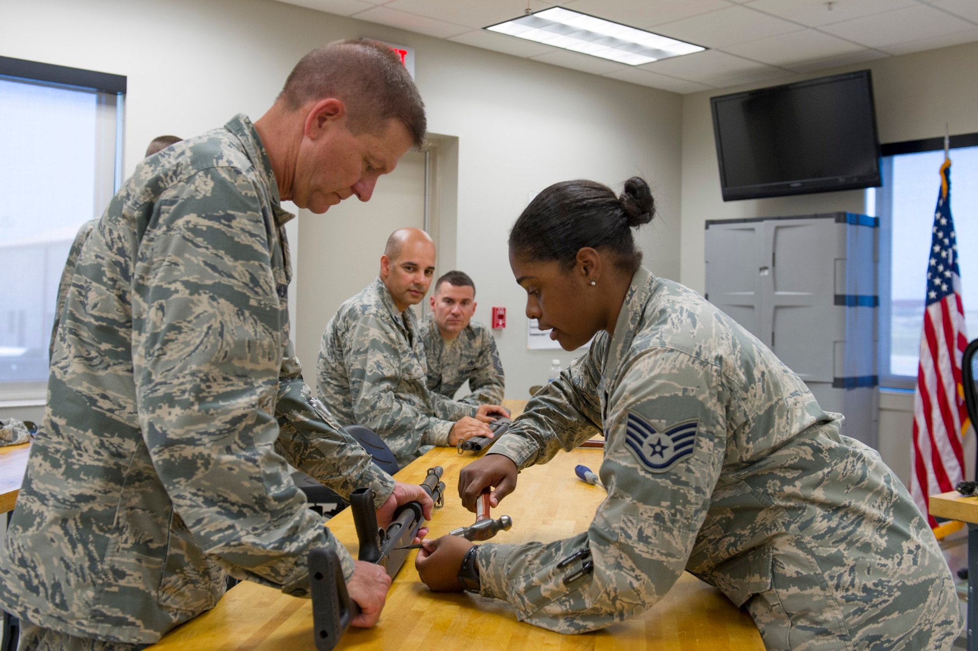 Brig. Gen. Wayne Monteith, 45th Space Wing commander and Chief Master Sgt. Jason Lamoureux, 45th SW command chief, got certified on the M870 shotgun during a certification course at Combat Arms Training Maintenance April 28, 2016 at Patrick Air Force Base, Fla. (U.S. Air Force photo/Matthew Jurgens) (Released) 