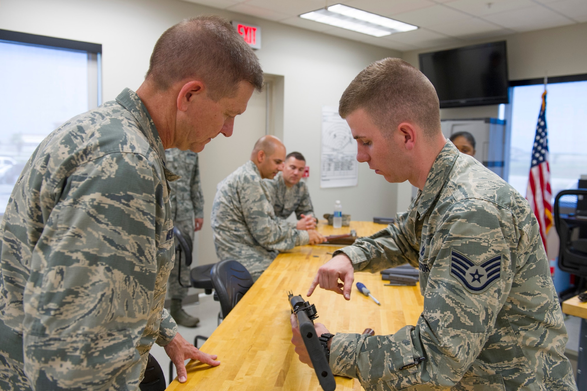 Brig. Gen. Wayne Monteith, 45th Space Wing commander and Chief Master Sgt. Jason Lamoureux, 45th SW command chief, got certified on the M870 shotgun during a certification course at Combat Arms Training Maintenance April 28, 2016 at Patrick Air Force Base, Fla. (U.S. Air Force photo/Matthew Jurgens) (Released) 