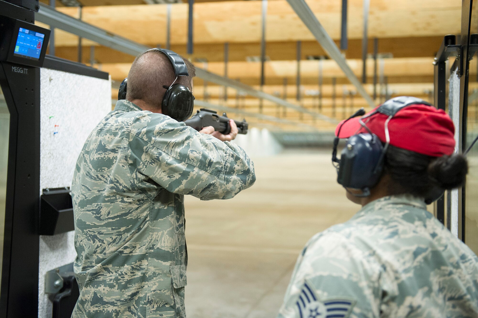Brig. Gen. Wayne Monteith, 45th Space Wing commander and Chief Master Sgt. Jason Lamoureux, 45th SW command chief, got certified on the M870 shotgun during a certification course at Combat Arms Training Maintenance April 28, 2016 at Patrick Air Force Base, Fla. (U.S. Air Force photo/Matthew Jurgens) (Released) 