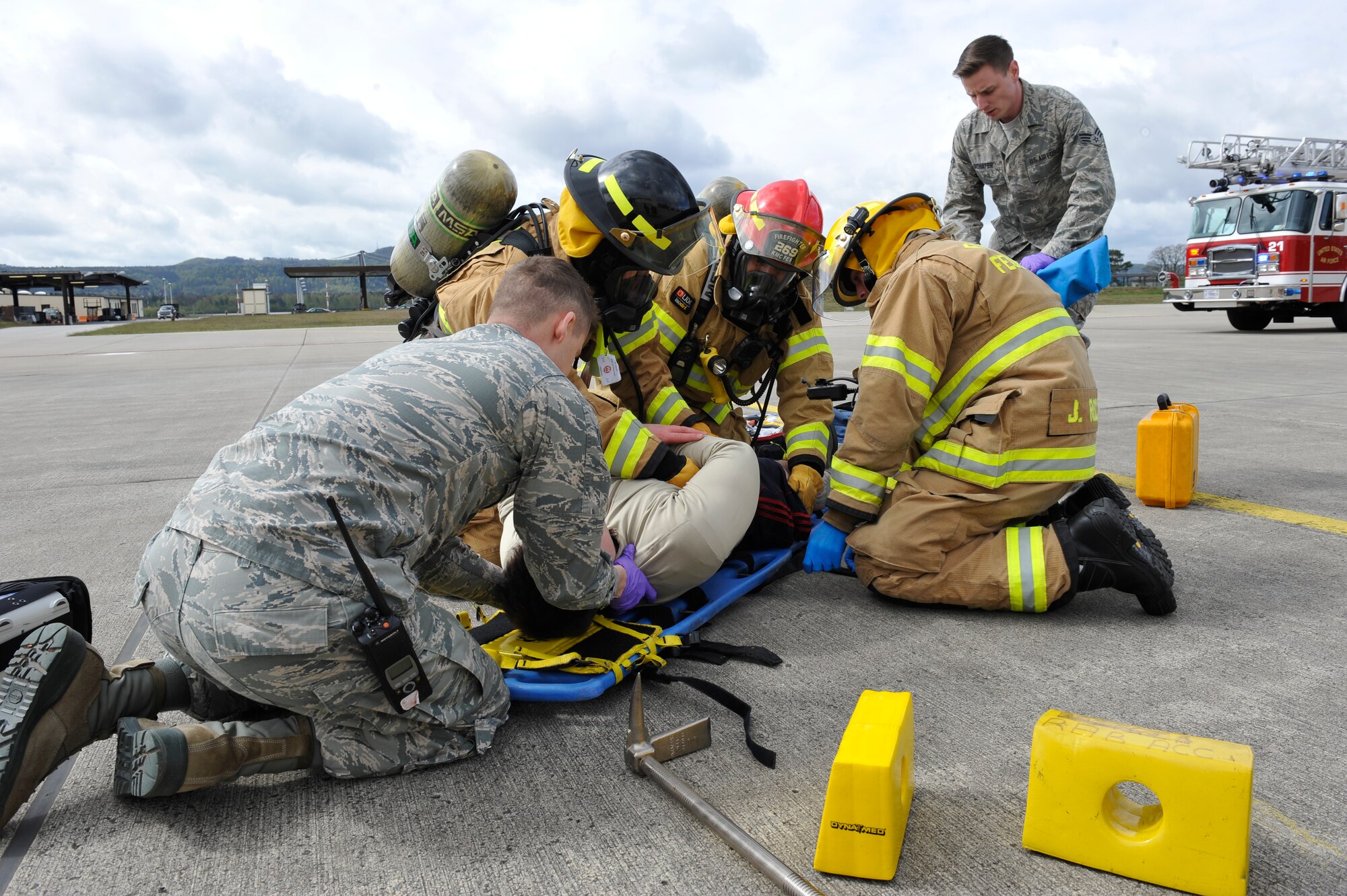 First responders prepare a simulated casualty for transport during Wing Thunder April 26, 2016, at Ramstein Air Base, Germany. Wing Thunder was an inspection to evaluate the operational readiness and response of Team Ramstein. (U.S. Air Force photo/Staff Sgt. Leslie Keopka)