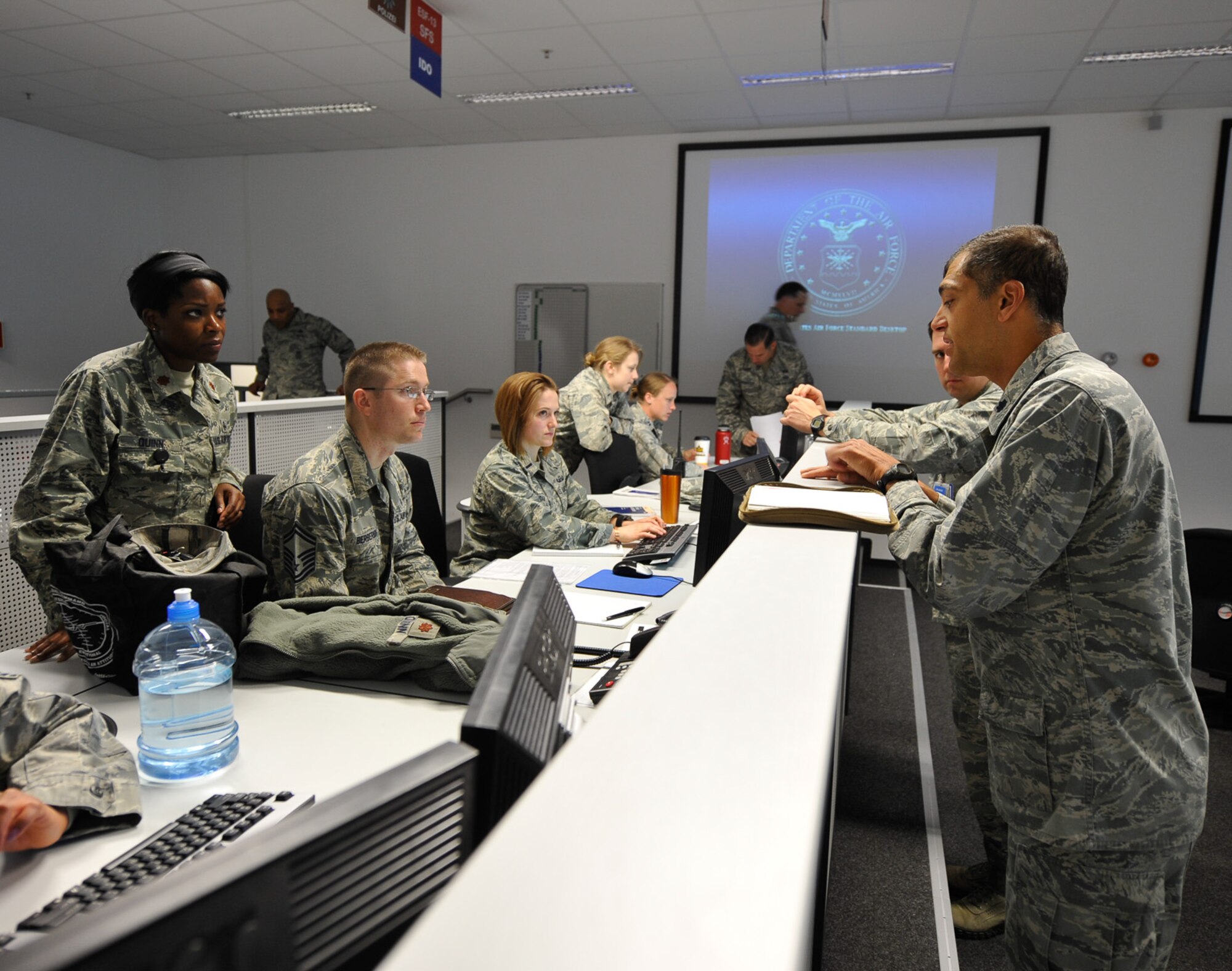 Lt. Col. Paul Silas, Ramstein’s Emergency Operations Center director, briefs EOC personnel on procedures and checklist during the Wing Thunder exercise April 25, 2016, at Ramstein Air Base, Germany. The EOC director acts as a liaison between the on-scene and installation commanders during exercise and real-world scenarios. (U.S. Air Force photo/Staff Sgt. Leslie Keopka)