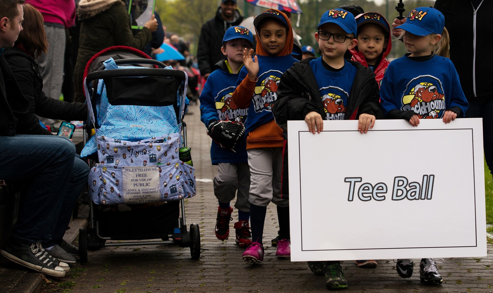 A group of tee-ball players participate in the opening day ceremony for the Kaiserslautern Military Community’s baseball season April 23, 2016, at Ramstein Air Base, Germany. The ceremonial first pitch is a longstanding ritual of American baseball in which a guest of honor throws the first pitch to launch the new season. (U.S. Air force photo/Airman 1st Class Lane T. Plummer)