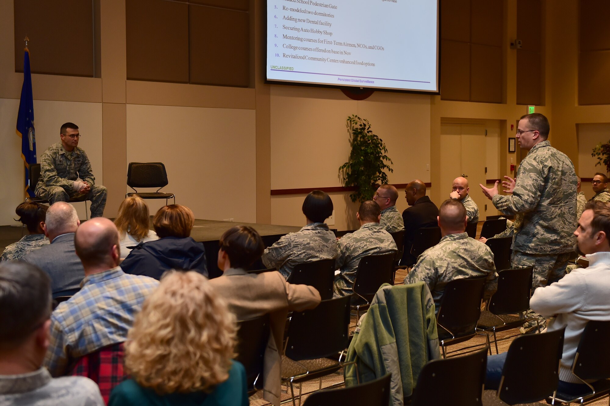 Lt. Col. Samuel Aston, 460th Logistics Readiness Squadron commander, answers questions regarding concerns and improvements during a town hall meeting April 28, 2016, at the Leadership Development Center on Buckley Air Force Base, Colo. Leaders from Buckley AFB met with base members to answer questions and provide information. (U.S. Air Force photo by Airman 1st Class Luke W. Nowakowski/Released) 
