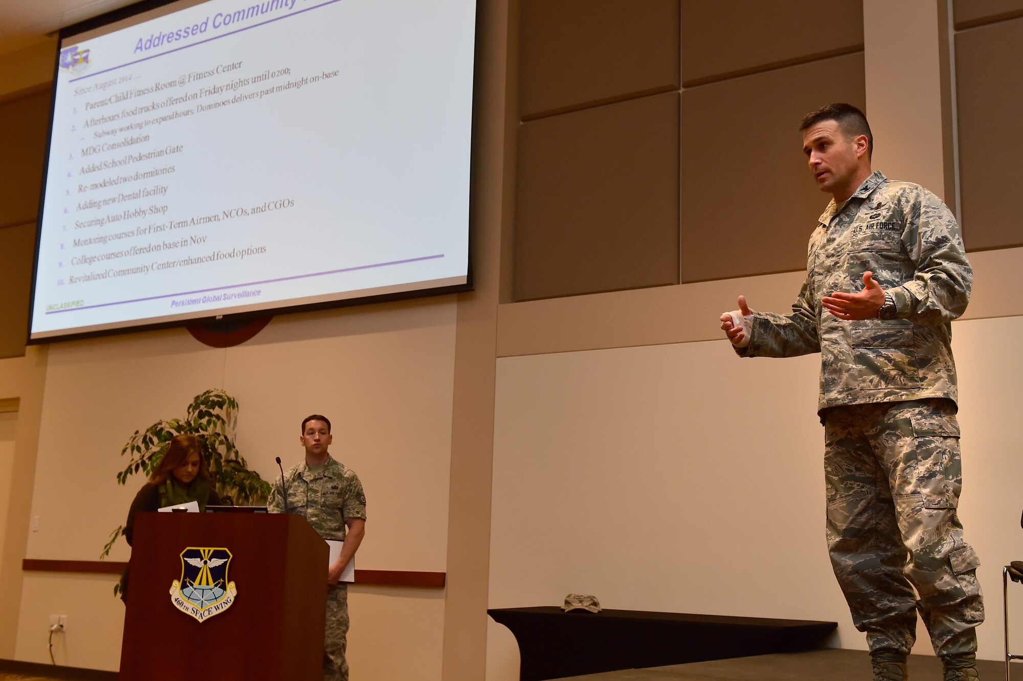 Col. John Wagner, 460th Space Wing commander, addresses the audience during a town hall meeting April 28, 2016, at the Leadership Development Center on Buckley Air Force Base, Colo. Wagner, along with other base leaders, highlighted improvements made to the base and answered questions and concerns made by members of the base community. (U.S. Air Force photo by Airman 1st Class Luke W. Nowakowski/Released)