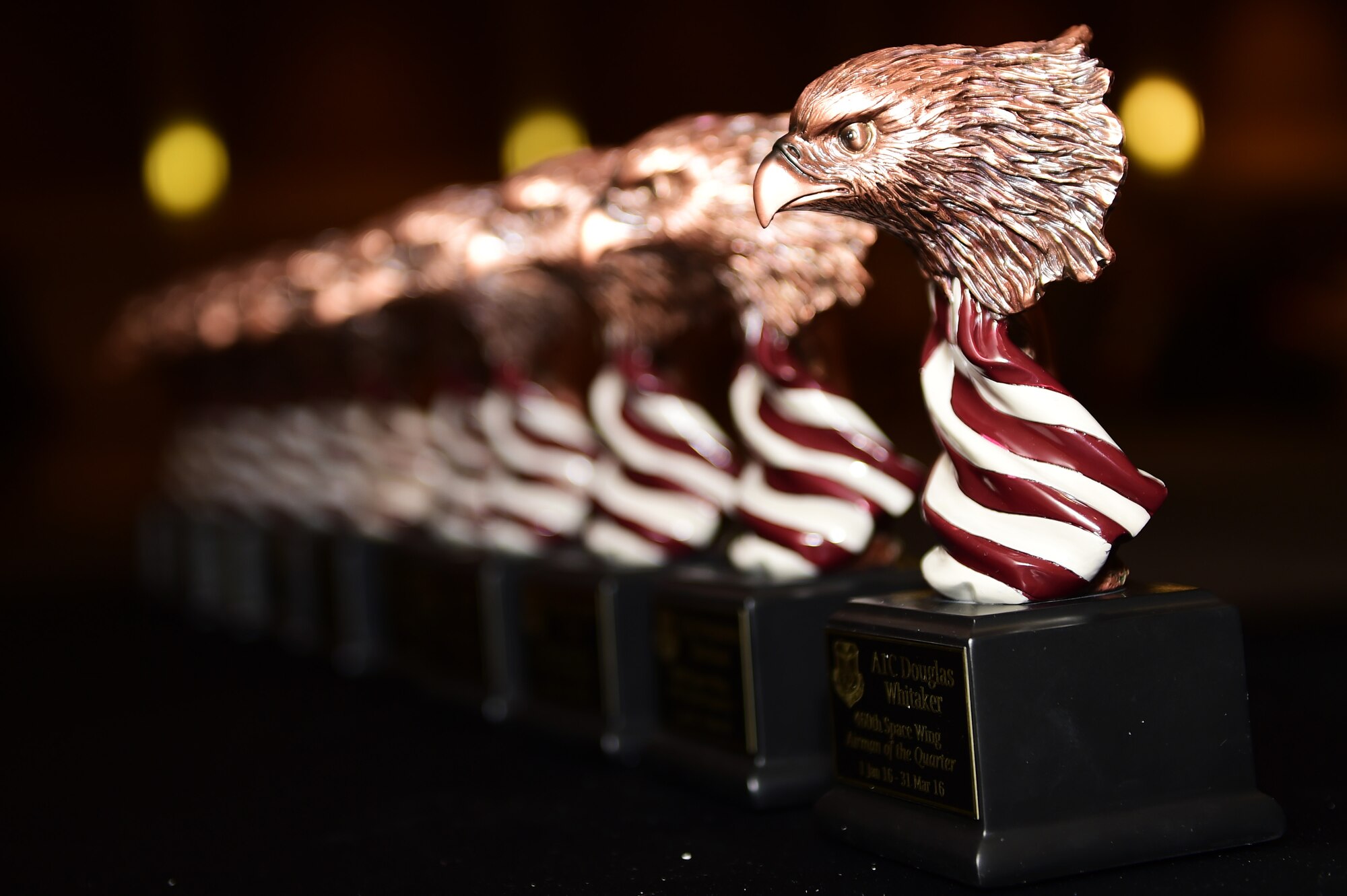Awards align on a table during the 460th Space Wing first quarter award ceremony April 28, 2016, at the Leadership Development Center on Buckley Air Force Base, Colo. Buckley team members are recognized for their hard work and effort in their duty sections. (U.S. Air Force photo by Senior Airman Racheal E. Watson/Released) 