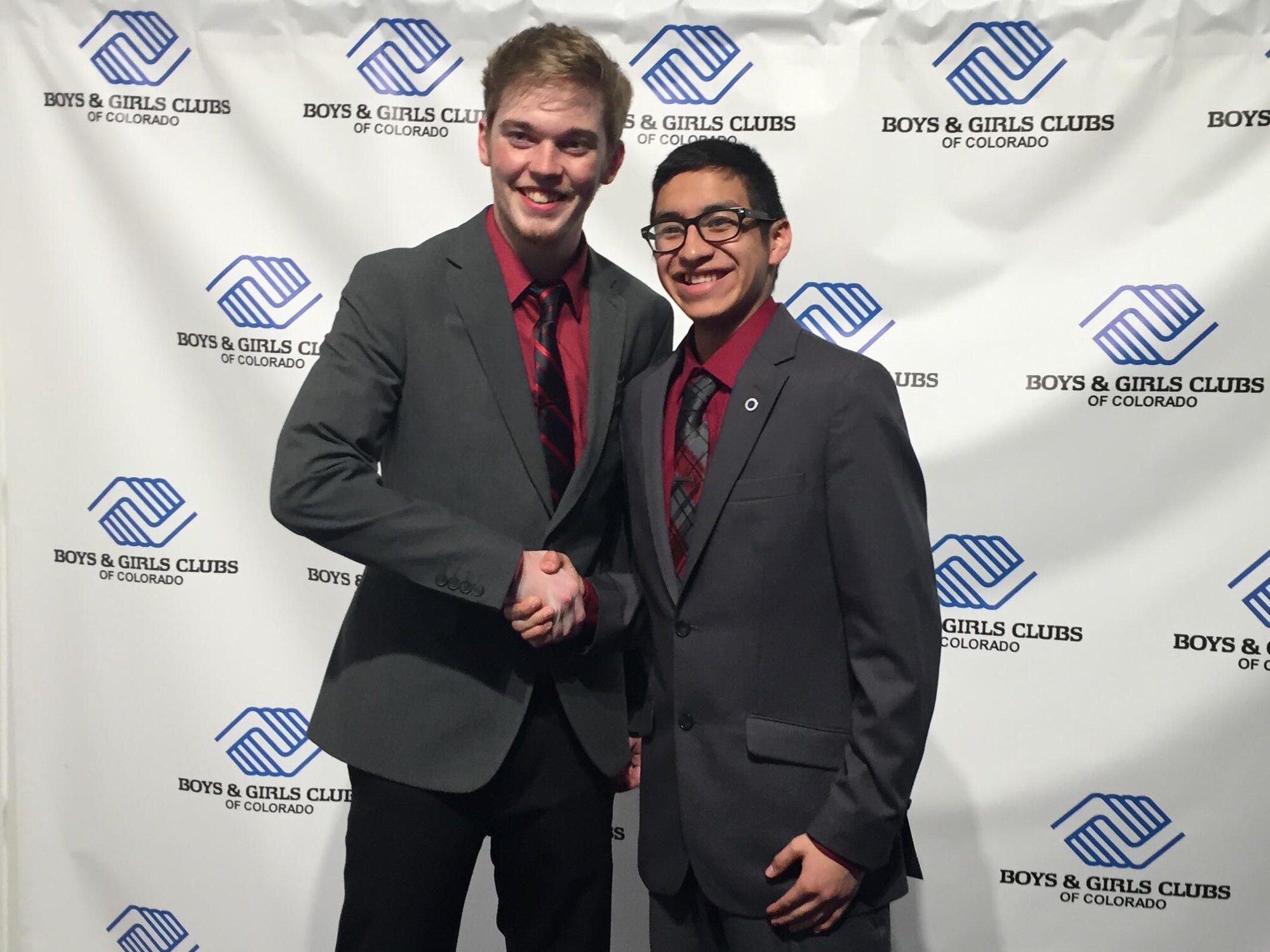 Ernesto Flores, 2016 Colorado Military Youth of the Year, shakes the hand of Clayton Starnes, 2016 Colorado State Youth of the Year, March 22, 2016, during the Colorado Youth of the Year Ceremony in Denver, Colo. The Youth of the Year program began in 1947 and is sponsored by the Boys and Girls Club to showcase the best and brightest youth from around the country. (Courtesy Photo)