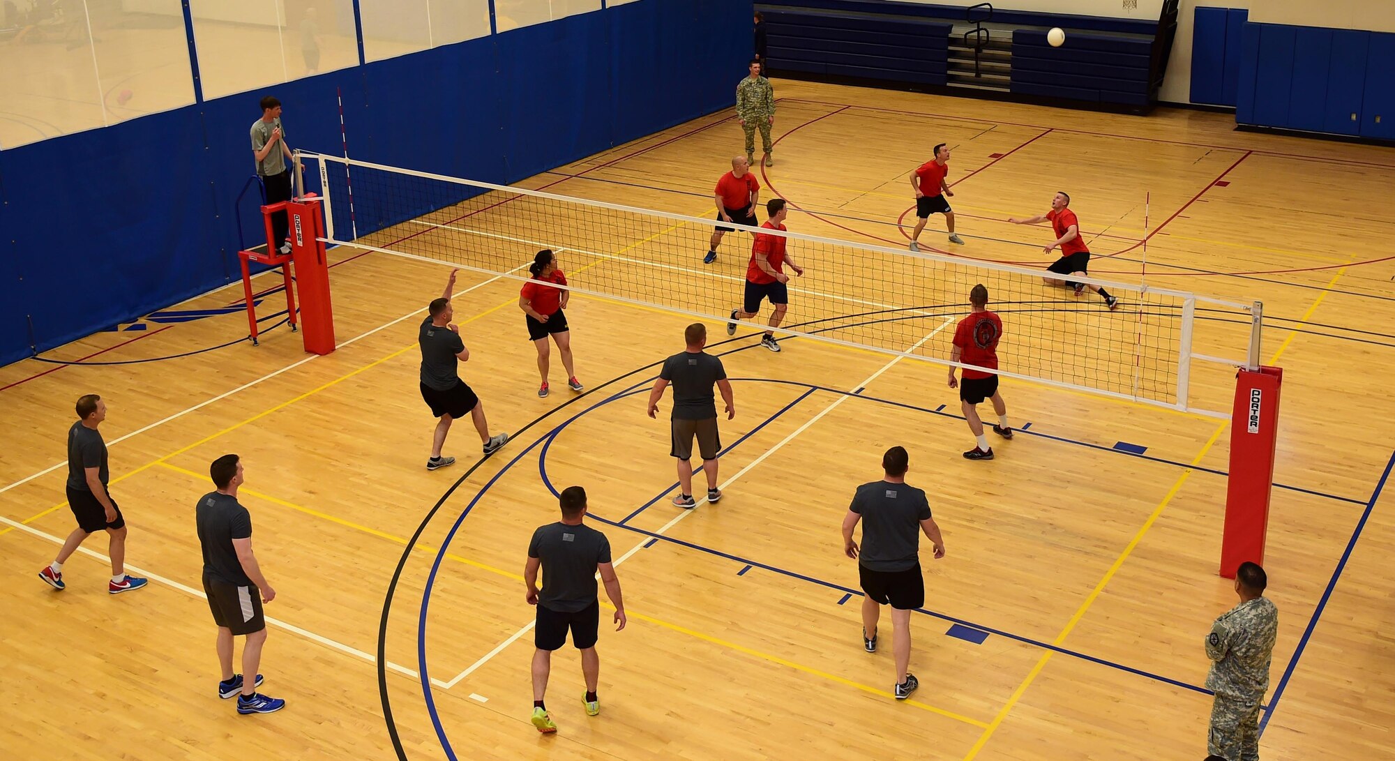 Members of the 743d Military Intelligence Battalion compete in an annual volleyball tournament April 28, 2016, at the Buckley Fitness Center on Buckley Air Force Base, Colo. Held over a two-day period, the tournament involved three teams and encouraged friendly inter-battalion competition. (U.S. Air Force photo by Airman 1st Class Gabrielle Spradling/Released)