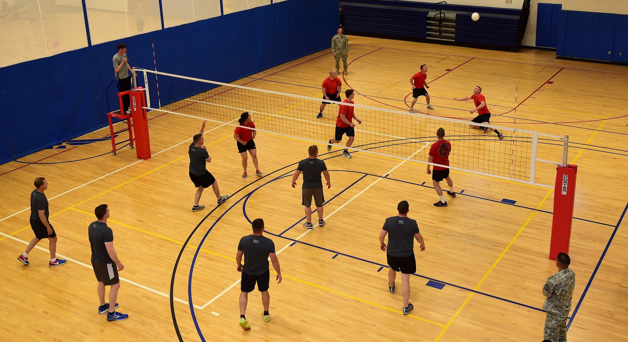 Members of the 743d Military Intelligence Battalion compete in an annual volleyball tournament April 28, 2016, at the Buckley Fitness Center on Buckley Air Force Base, Colo. Held over a two-day period, the tournament involved three teams and encouraged friendly inter-battalion competition. (U.S. Air Force photo by Airman 1st Class Gabrielle Spradling/Released)