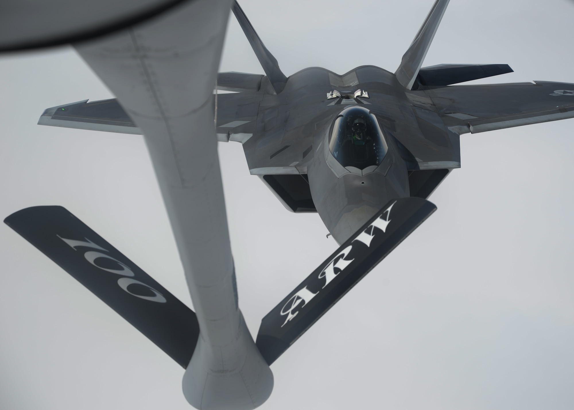A U.S. Air Force F-22 Raptor assigned to the 95th Fighter Squadron at Tyndall Air Force Base, Fla., pulls into position to receive fuel from a 100th Air Refueling Wing KC-135 Stratotanker assigned to RAF Mildenhall, England, April 27, 2016, in route to Šiauliai Air Base, Lithuania. The aircraft will conduct air training with other Europe-based aircraft, demonstrating the U.S. commitment to NATO allies and the security of Europe. (U.S. Air Force photo by Staff Sgt. Nathan Tucker/Released)