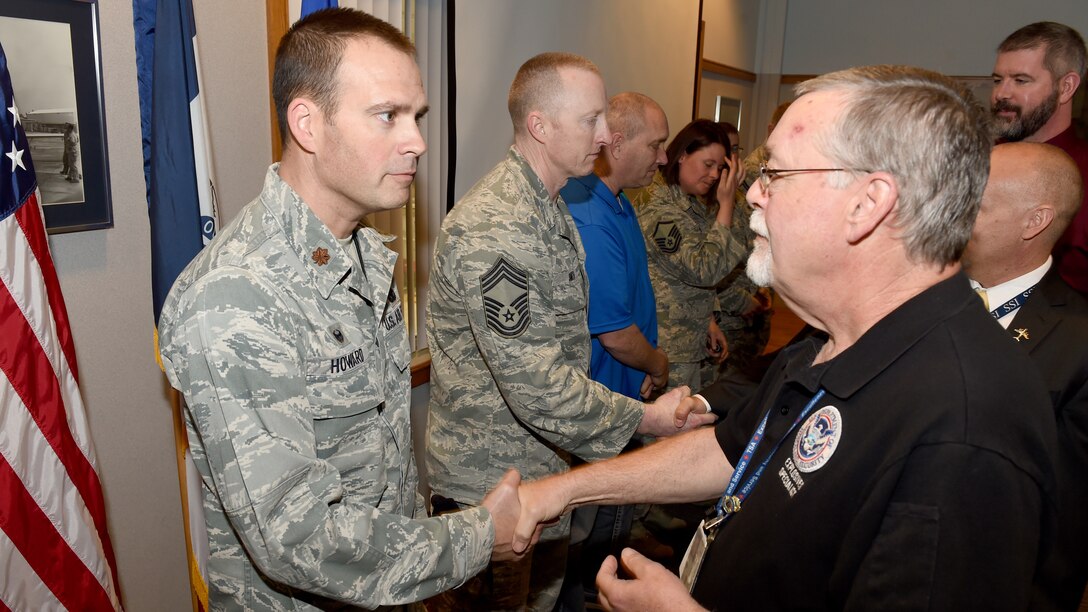 Members of the 132d Wing Security Forces were recognized at a ceremony in the wing classroom. Employees with the TSA presented members with coins for their work in assisting the TSA in training. (U.S. Air National Guard photo by Staff Sgt. Matthew T. Doyle/Released)