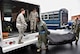During a light rain, members of the 932nd Airlift Wing Aeromedical Evacuation Squadron load gear into a box truck in preparation for a training flight on a KC-135, April 30, 2016, Scott Air Force Base, Illinois.  (U.S. Air Force photo by Tech. Sgt. Christopher Parr)
