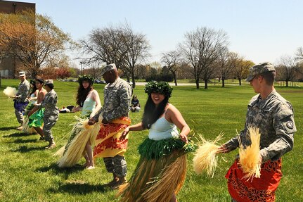 Army Reserve soldiers, from the 85th Support Command, dance with the Barefoot Hawaiian performing arts group during the command’s Asian American and Pacific Islander Heritage month observance, May 2. (U.S. Army photo by Sgt. Aaron Berogan/Released)