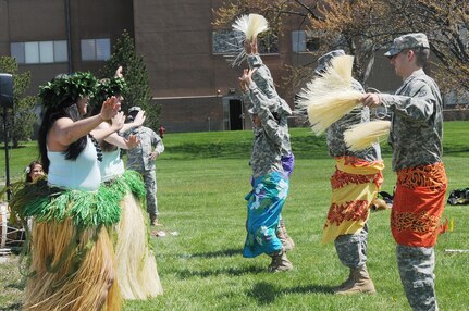 Army Reserve soldiers, from the 85th Support Command, dance with the Barefoot Hawaiian performing arts group during the command’s Asian American and Pacific Islander Heritage month observance May 2. (U.S. Army photo by Spc. David Lietz/Released)