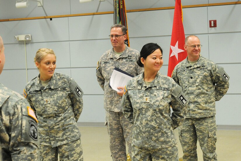 Second Lt. Jiaru Bryar, right, 3rd Battalion, 335 Regiment, smiles during her commissioning ceremony, with 2nd Lt. Joanna McCarthy, left, both commissioned at the Fort Sheridan Army Reserve Center, Jan. 10. Bryar, shared her story during Asian American and Pacific Islander Heritage Month 2015 discussing her journey as a child from Chang Chun city, in the Ji Lin province, located in northeastern People’s Republic of China to becoming an Army Reserve officer based in Chicago.
(U.S. Army photo by Sgt. Aaron Berogan/Released)