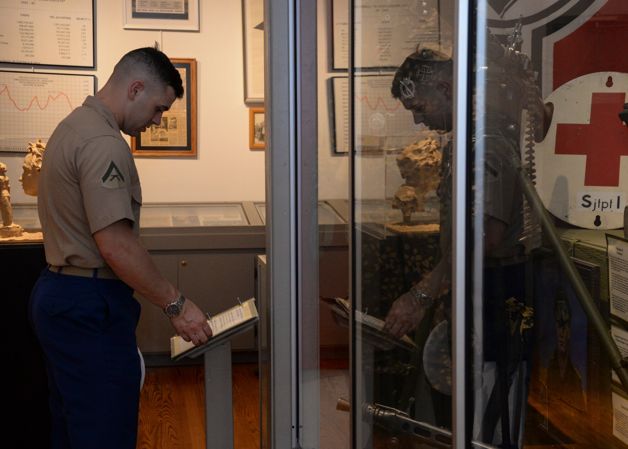 U.S. Marine Corps Lance Cpl. Matt Thompson, a loadmaster student at Center for Naval Aviation Technical Training, looks through a World War II medical guide during the Welcome Home Vietnam Veterans ceremony April 30, 2016, at the Jacksonville Museum of Military History, Jacksonville, Ark. The museum displays decades of war memorabilia from the Civil War to the war in Afghanistan. (U.S. Air Force photo by Staff Sgt. Jessica Condit)