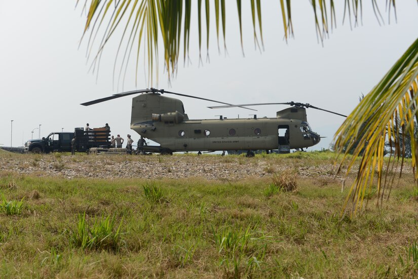 A CH-47 Chinook helicopter assigned to the 1st battalion, 228th Aviation Regiment arrives in Puerto Castilla, Honduras, to transport service members from Joint Task Force-Bravo and their equipment back to Soto Cano Airbase on the final day of a U.S. Southern Command Situational Assessment Team (S-SAT) validation exercise, April 27, 2016. This event took place during an Army SOUTH hosted exercise called Fuerzas Aliadas Humanitarias, which is an annual event that tests the capabilities of Caribbean and Central American nations to respond to a natural disaster or humanitarian crisis. (U.S. Army photo by Frederick Hoyt/Released) 