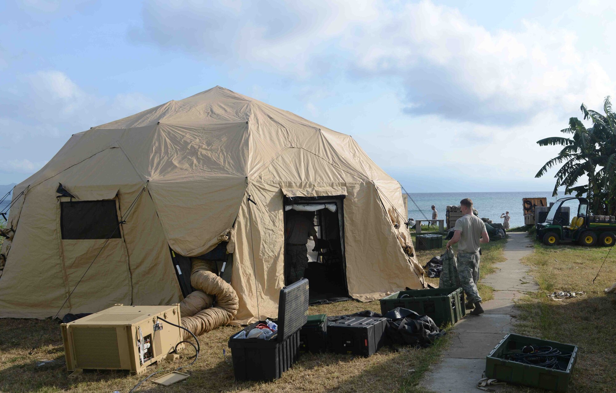Air Force and Army service members from Joint Task Force-Bravo finish setting up a mobile tactical operations center in Puerto Castilla, Honduras, as part of a SOUTHCOM Situational Assessment Team (S-SAT), validation exercise, April 25, 2016. This three-day exercise took place during an Army SOUTH-hosted exercise called Fuerzas Aliadas Humanitarias, which is an annual event that tests the abilities of Caribbean and Central American nations to respond to a natural disaster or humanitarian crisis. (U.S. Army photo by Frederick Hoyt/Released) 