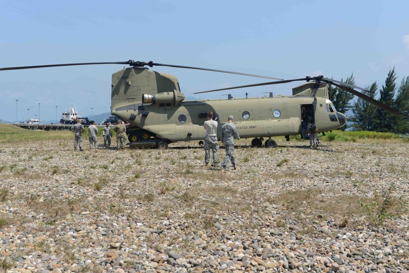Members of Joint Task Force-Bravo, stationed at Soto Cano Air Base, Honduras, unload equipment from a CH-47 Chinook helicopter assigned to the 1st battalion, 228th Aviation Regiment, while on a SOUTHCOM Situational Assessment Team (S-SAT) validation exercise deployment to Puerto Castilla, department of Colón, Honduras, April 25, 2016. The S-SAT is necessary to conduct assessments before significant military resources are committed to a humanitarian assistance or disaster response event. (U.S. Army photo by Frederick Hoyt/Released) 
