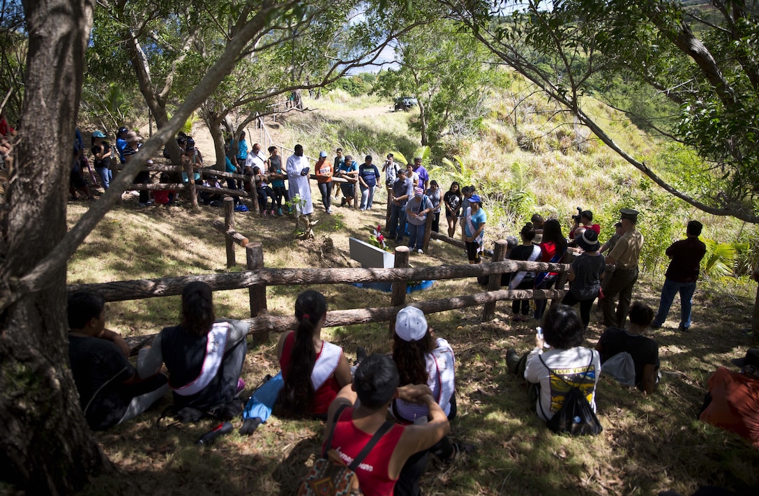 MERIZO, Guam (July 15, 2016) – Capt. Brian Ralston and Sgt. Chris Henderson, from Marine Corps Activity Guam, joined the citizens of Guam at the Tinta and Faha Massacre Memorial sites to remember those that lost their lives during occupation in World War II.