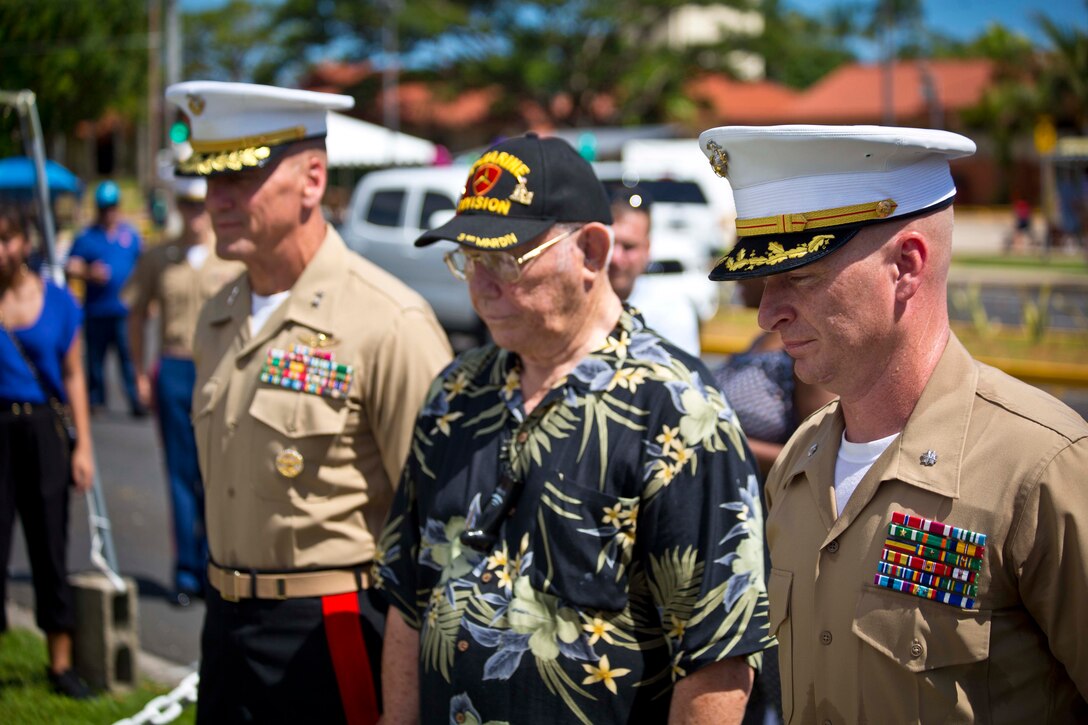 HAGÅTÑA, Guam (July 21,2016) – Maj. Gen. Simcock and Lt. Col. Reynolds, stand with retired Marine Corps Cpl. Glenn Bell, as they lay a wreath during the 72nd annual Liberation Day parade. The Marines escorted the Liberation Day Queen, Royal Princess, and Princesses during the parade. Maj. Gen. Richard Simcock II and Sgt. Maj. Vincent Santiago from 3rd Marine Division, attended this years parade with fellow service members and the community of Guam.