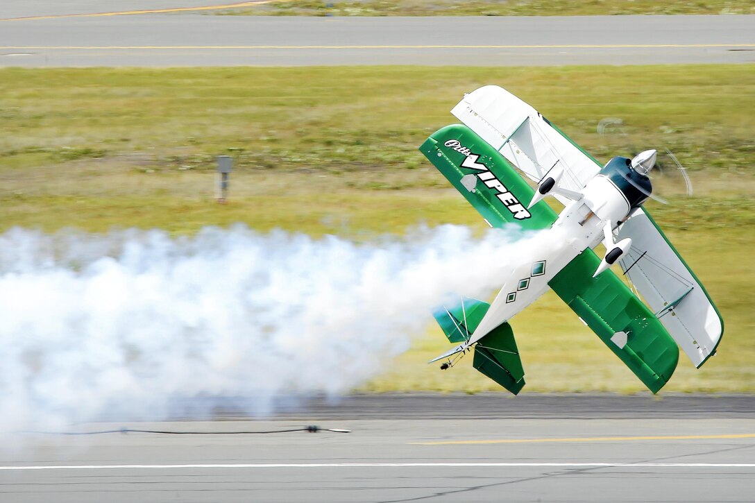 Jason Newburg flies his modified Pitts S25 known as the Viper during the Arctic Thunder Special Needs and Family Day at Joint Base Elmendorf-Richardson, Alaska, July 29, 2016. Air Force photo by Alejandro Pena