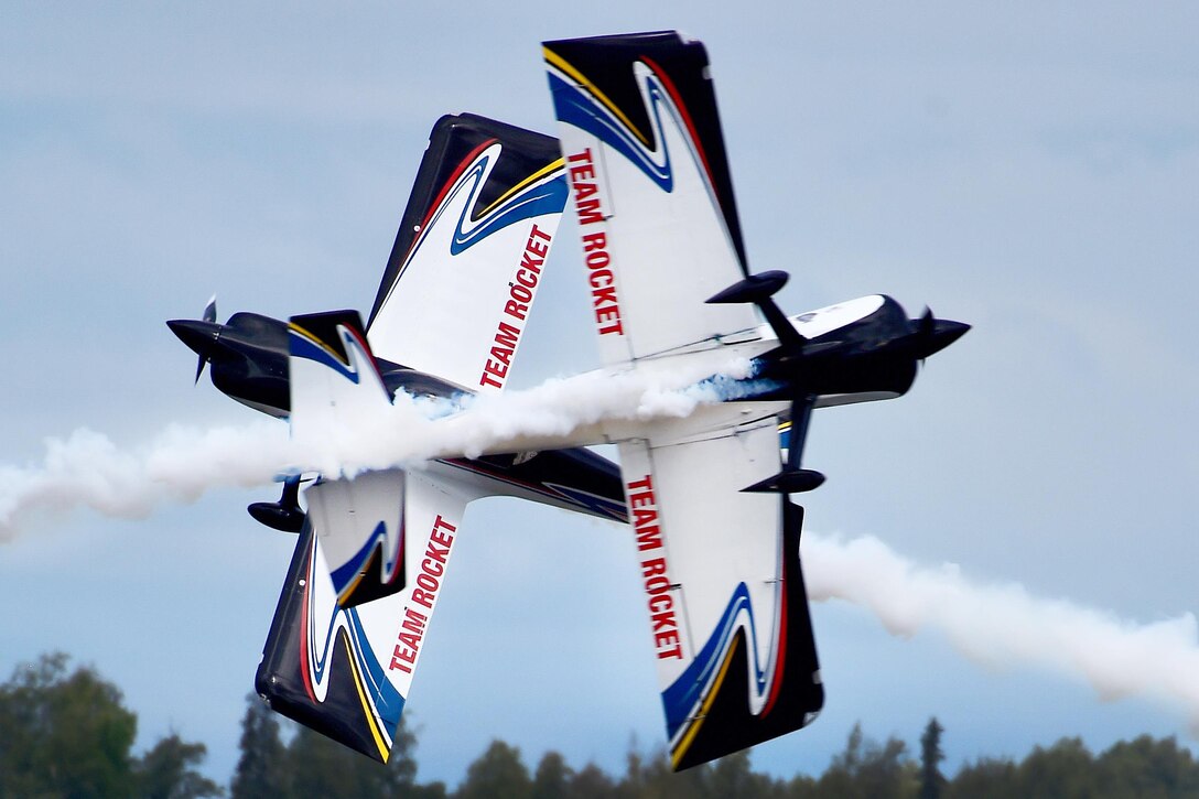 Eric Hansen and Ken Fowler of Team Rocket make a close high-speed pass during the Arctic Thunder Special Needs and Family Day at Joint Base Elmendorf-Richardson, Alaska, July 30, 2016. Air Force photo by Justin Connaher