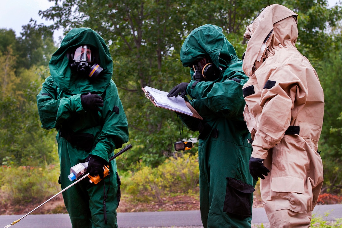 Soldiers discuss plans before participating in a recon mission during Vigilant Guard 2016 at Camp Johnson, Vt., July 28, 2016. The soldier is assigned to the Oklahoma National Guard’s 63rd Civil Support Team. Vigilant Guard is a national level emergency response exercise, sponsored by the National Guard and U.S. Northern Command, which provides units an opportunity to improve cooperation and relationships with regional civilian, military, and federal partners in preparation for emergencies and catastrophic events. Air National Guard photo by Tech. Sgt. Chelsea Clark