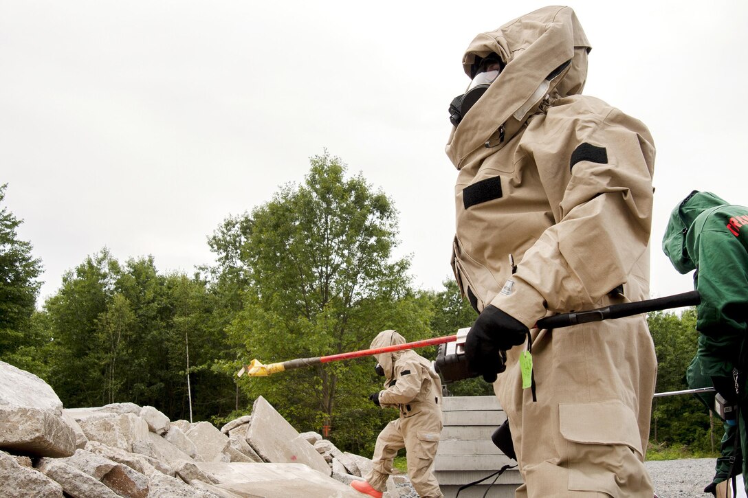 Soldiers cautiously proceed up on a pile of rubble simulating a natural disaster during the Vigilant Guard 2016 training exercise at Camp Johnson, Vt., July 28, 2016. Air National Guard photo by Tech. Sgt. Chelsea Clark