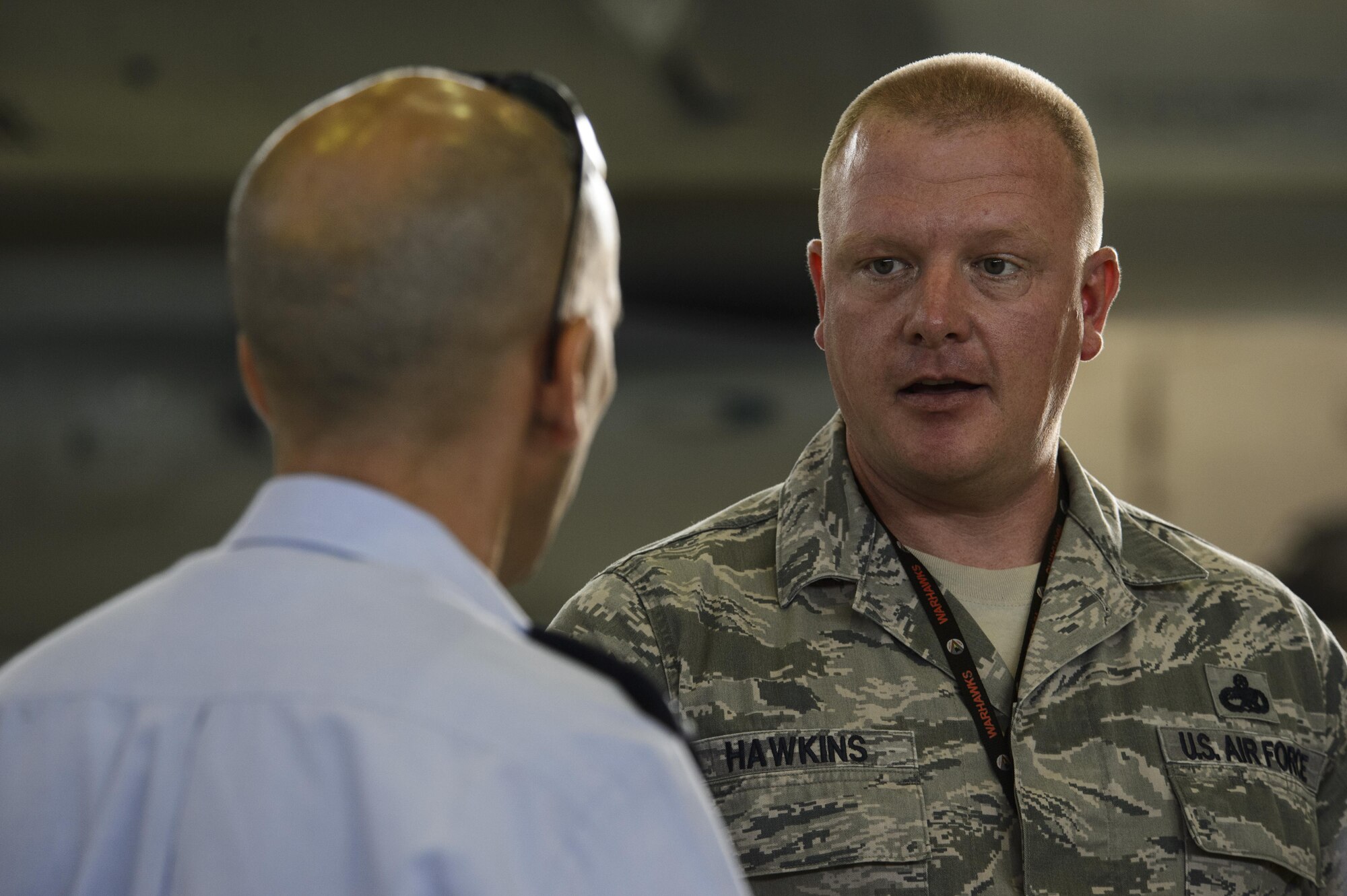 U.S. Air Force Master Sgt. William Hawkins, 52nd Aircraft Maintenance Squadron production superintendent, talks about the capabilities of the 52nd AMXS supporting the F-16 Fighting Falcons to Brig. Gen. Tal Kelman, Israeli air force vice chief of staff, during his visit at Spangdahlem Air Base, Germany, July 27, 2016. Kelman's is visiting the base while attending the Air Senior National Representative forum, which works on enhancing IAF and USAF cooperation. (U.S. Air Force photo by Staff Sgt. Jonathan Snyder)