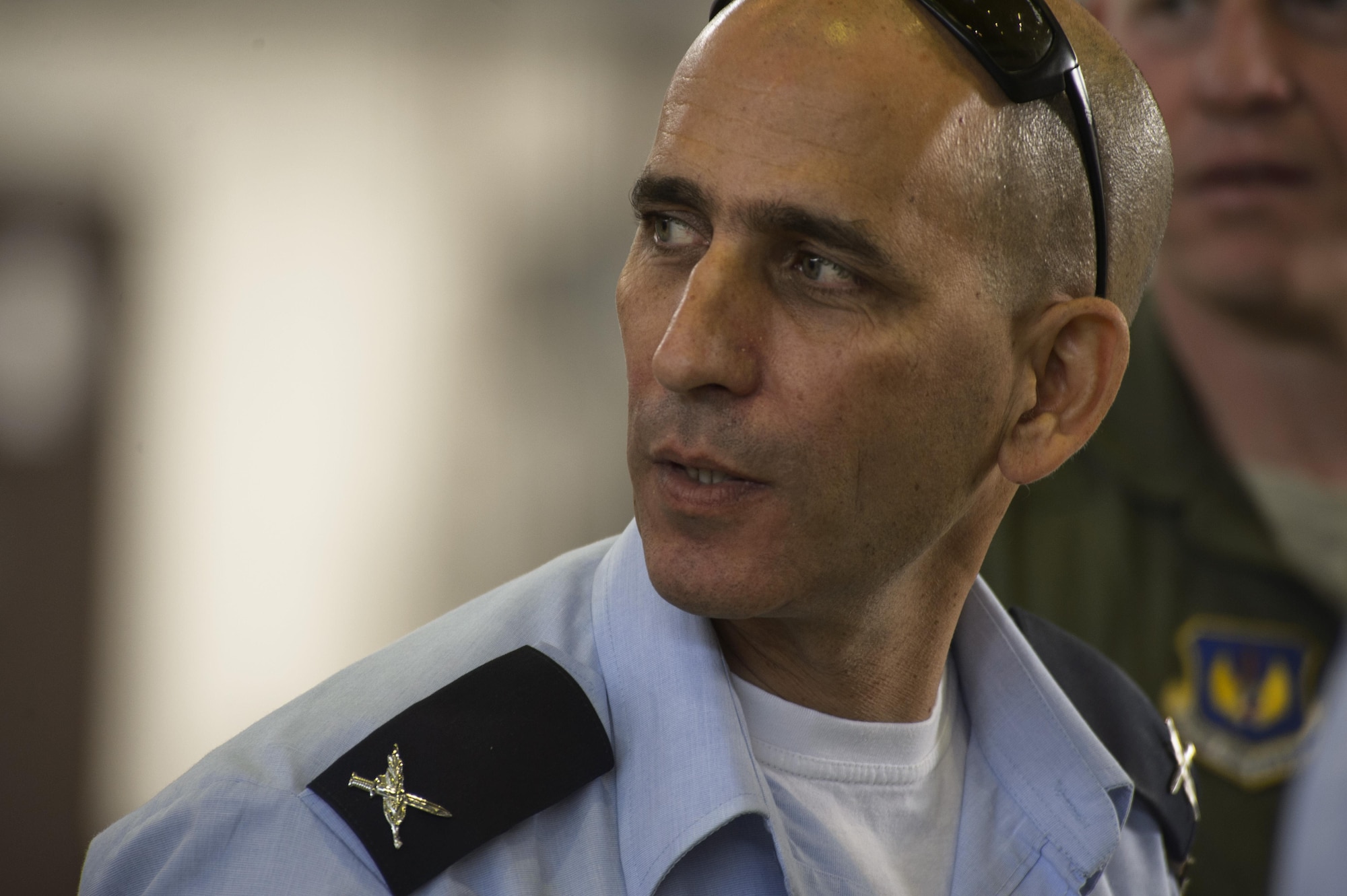 Brig. Gen. Tal Kelman, Israeli air force vice chief of staff, listens to U.S. Air Force Master Sgt. William Hawkins, 52nd Aircraft Maintenance Squadron production superintendent, talk about the capabilities of the 52nd AMXS supporting the F-16 Fighting Falcons to during his visit at Spangdahlem Air Base, Germany, July 27, 2016. Kelman's is visiting the base while attending the Air Senior National Representative forum, which works on enhancing IAF and USAF cooperation. (U.S. Air Force photo by Staff Sgt. Jonathan Snyder)