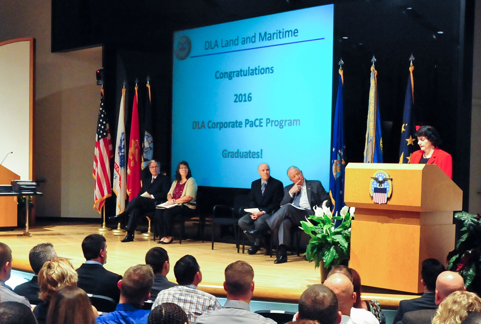 Pam Latker, chief of the Career Management Division of Defense Logistics Agency Human Resources, addresses a class of 80 graduating students of DLA's Pathways to Career Excellence (PaCE) Program. 