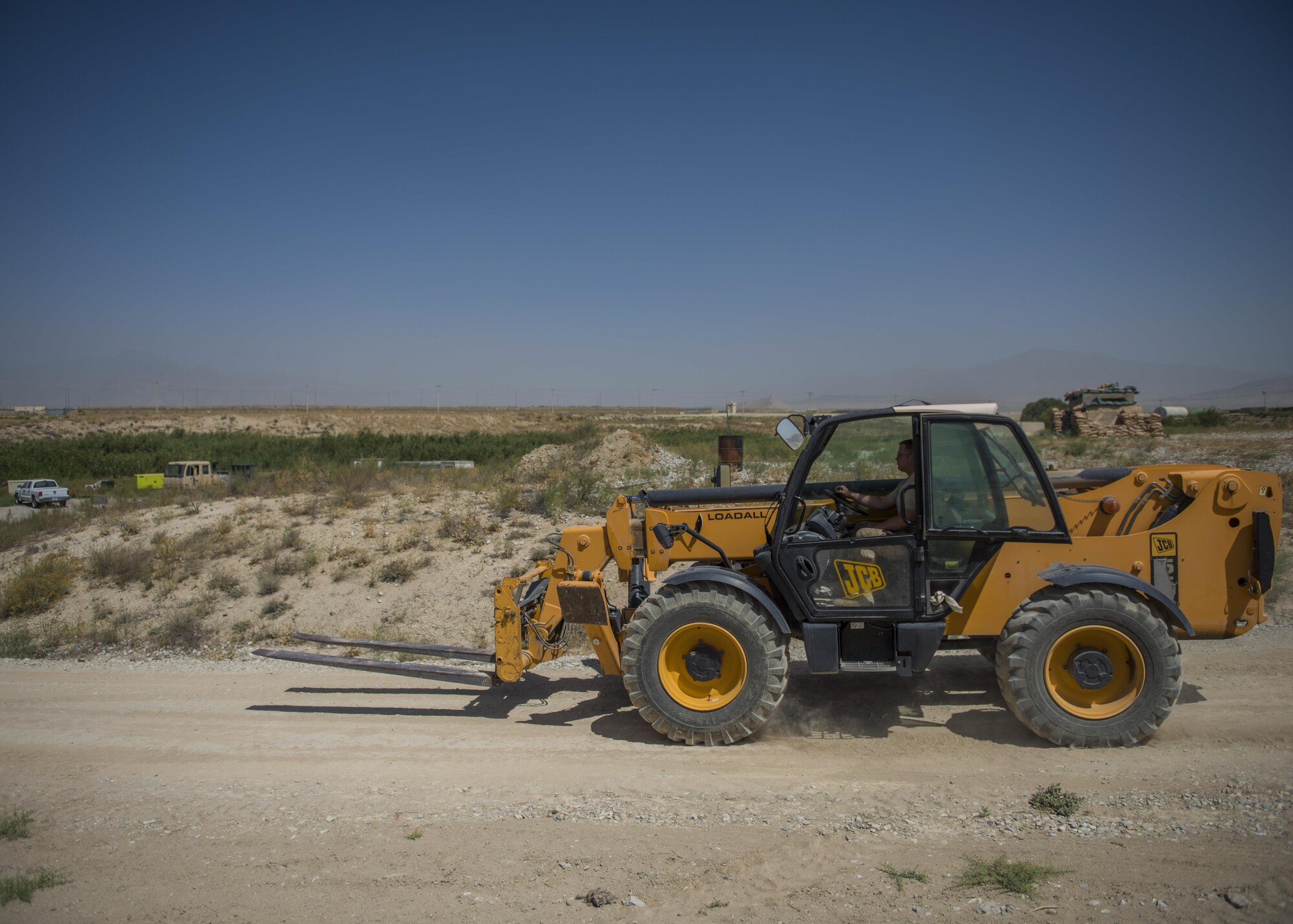 Tech. Sgt. Timothy Cook, 455th Expeditionary Security Forces Squadron, supply and logistics noncommissioned officer in charge, drives a forklift, Bagram Airfield, Afghanistan, Aug. 1, 2016. The supply and logistics team use heavy machinery to transport equipment and supplies. (U.S. Air Force photo by Senior Airman Justyn M. Freeman)