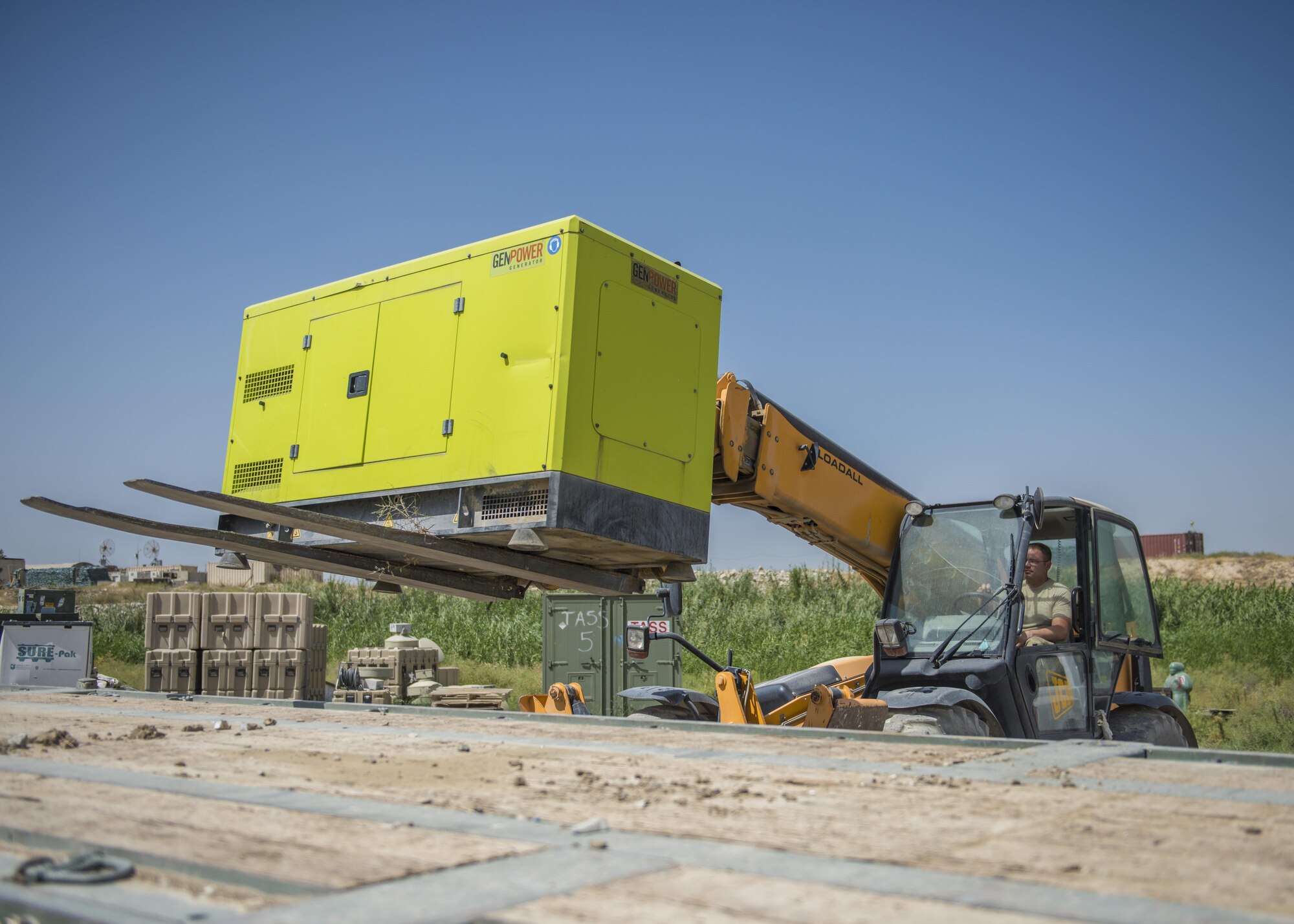 Tech. Sgt. Timothy Cook, 455th Expeditionary Security Forces Squadron, supply and logistics noncommissioned officer in charge, transports a generator to a flatbed truck, Bagram Airfield, Afghanistan, Aug. 1, 2016. Logistics and Supply otherwise known as S4, is responsible for the equipping and readiness of home station and deploying forces. (U.S. Air Force photo by Senior Airman Justyn M. Freeman)