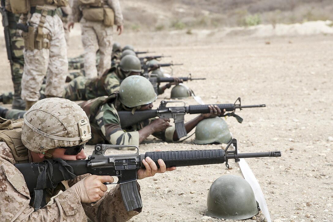 Lance Cpl. Thomas Jamieson, a rifleman with Special Purpose Marine Air-Ground Task Force Crisis Response-Africa, tests a weapon during a live-fire range with the Compagnie Fusilier de Marin Commando in Thies, Senegal, July 22, 2016. Marines and the COFUMACO conducted a three-week training exercise that included advanced combat firing techniques, a machine gun range and a live-fire platoon attack range. (U.S. Marine Corps photo by 1st Lt. Eric Abrams /released)