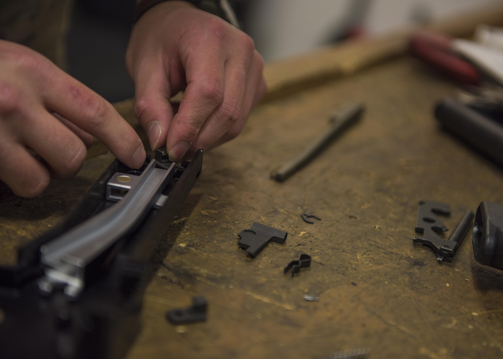 Staff Sgt. Derrick Woods, 455th Expeditionary Security Forces Squadron, supply and logistics technician, repairs a M240B machine gun, Bagram Airfield, Afghanistan, Aug. 1, 2016. The logistics and supply section provides security forces members with the best equipment available to ensure they are always prepared to defend. (U.S. Air Force photo by Senior Airman Justyn M. Freeman)