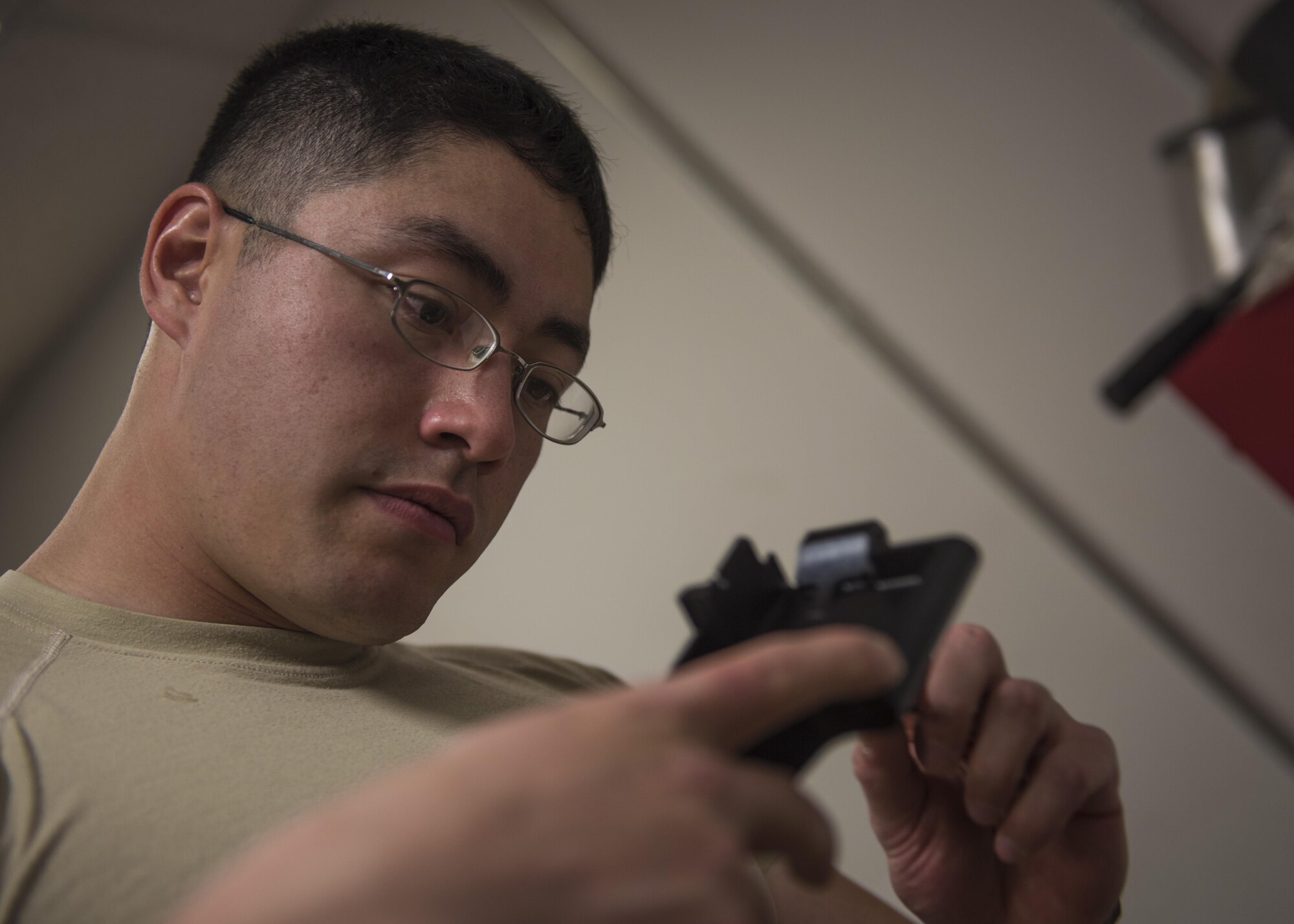 Staff Sgt. Derrick Woods, 455th Expeditionary Security Forces Squadron, supply and logistics technician, repairs a M240B machine gun, Bagram Airfield, Afghanistan, Aug. 1, 2016. The logistics and supply section are responsible for the 455th ESFS logistics, combat arms training, vehicle control, and equipment maintenance. (U.S. Air Force photo by Senior Airman Justyn M. Freeman)