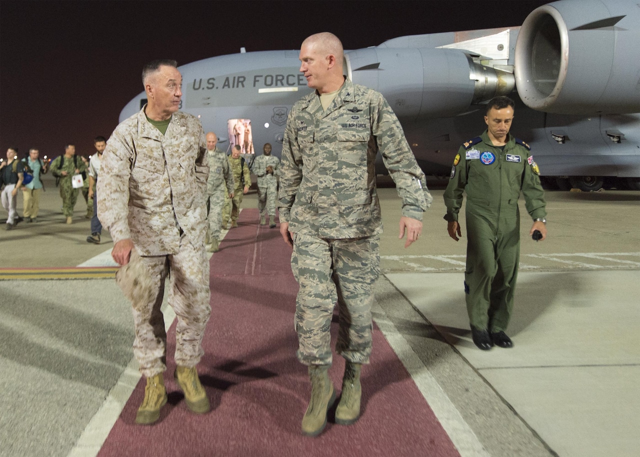 Marine Corps Gen. Joe Dunford, chairman of the Joint Chiefs of Staff, speaks with a member of the U.S. Air Force after arriving at Incirlik Air Base, July 31, 2016. DoD photo by Navy Petty Officer 2nd Class Dominique A. Pineiro