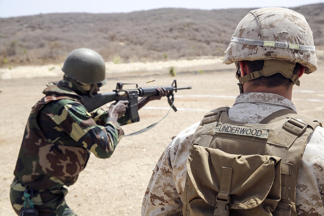 Sgt. Ryan Underwood, a rifleman with Special Purpose Marine Air-Ground Task Force Crisis Response-Africa, observes a live-fire training exercise with the Compagnie Fusilier de Marin Commando in Thies, Senegal, July 22, 2016. Marines and the COFUMACO conducted a three-week training exercise that included advanced combat firing techniques, a machine gun range and a live-fire platoon attack range. (U.S. Marine Corps photo by 1st Lt. Eric Abrams /released)