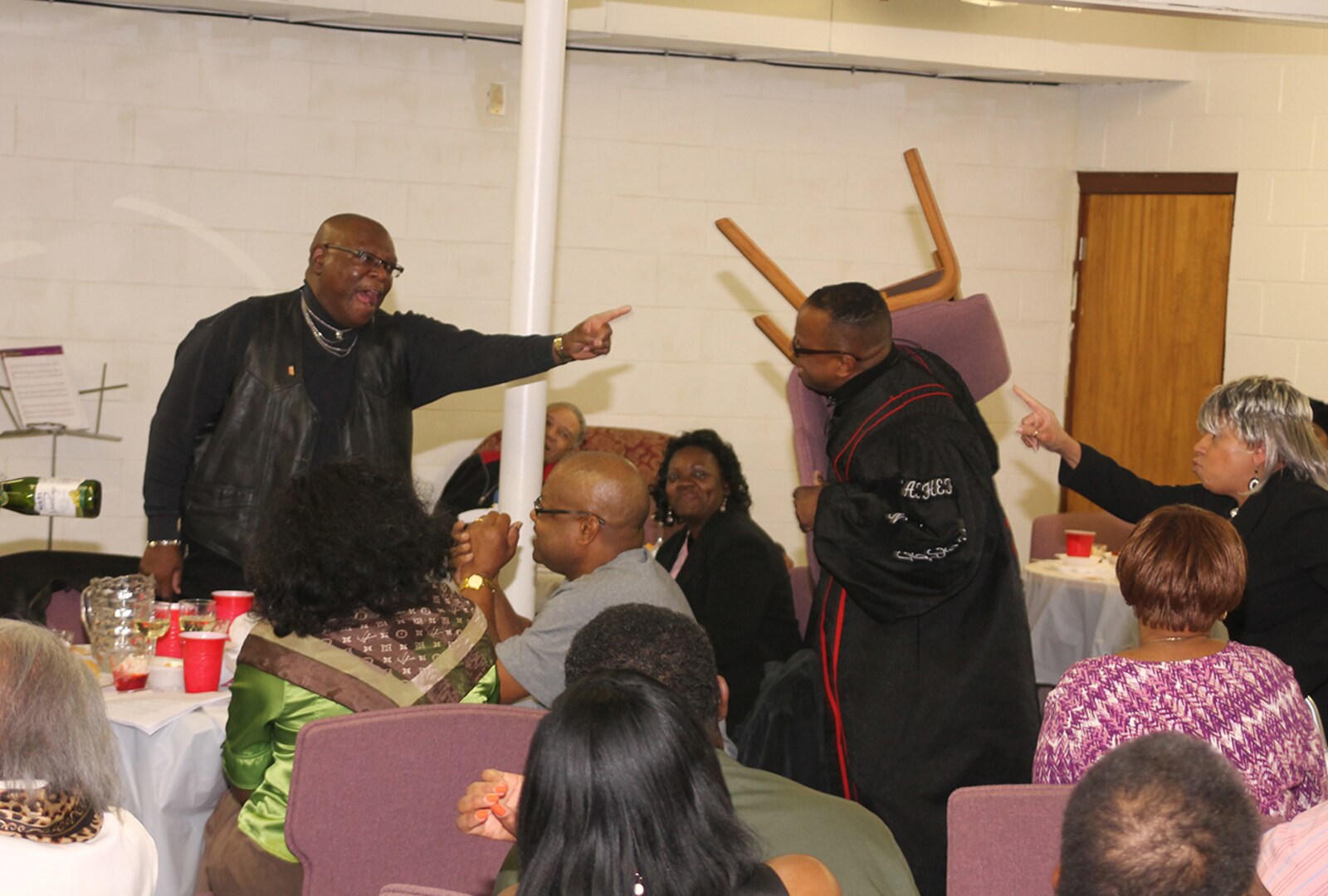 In a scene from "Matrimony Celebration for Curly and Sue Brown", audience members sit among the actors for a realistic experience. DLA Land and Maritime associate Linda Thomas wrote and produced the play for the New Faith Baptist Church of Christ in Columbus, Ohio. 