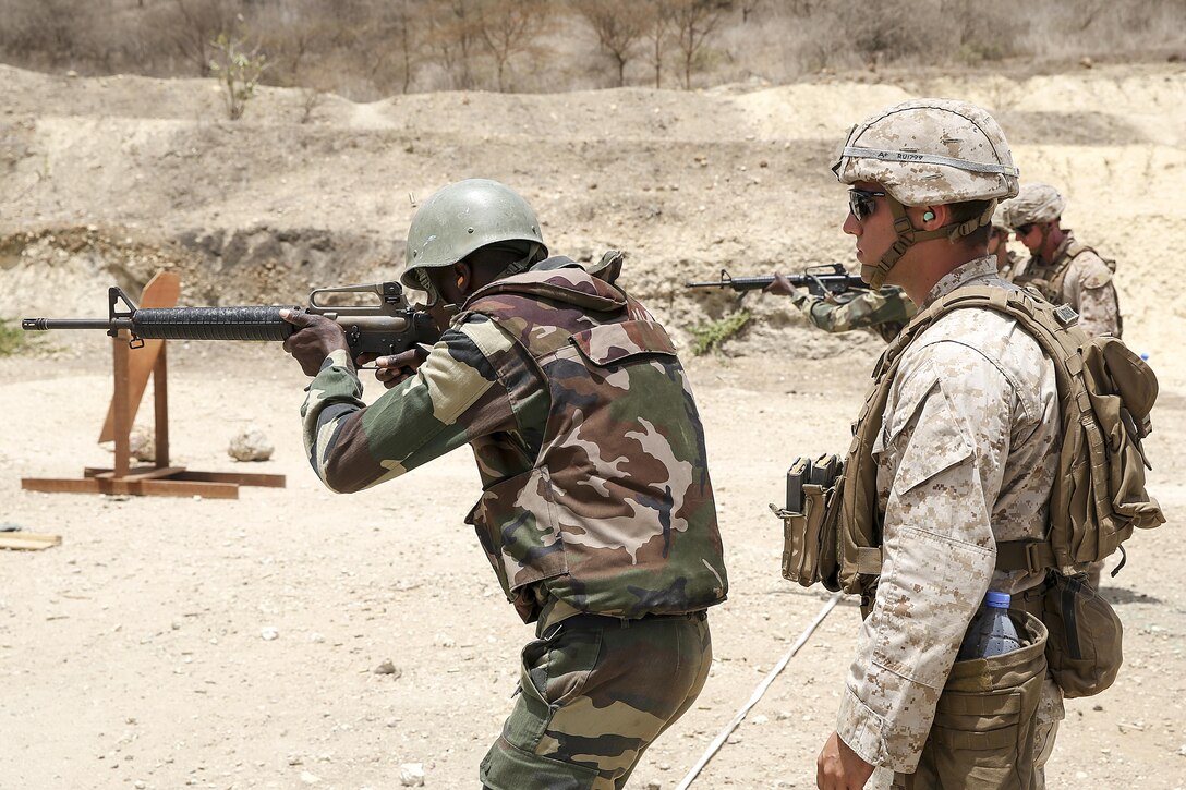 Sgt. Ryan Underwood, a rifleman with Special Purpose Marine Air-Ground Task Force Crisis Response-Africa, observes a live-fire training exercise with the Compagnie Fusilier de Marin Commando in Thies, Senegal, July 22, 2016. Marines and the COFUMACO conducted a three-week training exercise that included advanced combat firing techniques, a machine gun range and a live-fire platoon attack range. (U.S. Marine Corps photo by 1st Lt. Eric Abrams /released)
